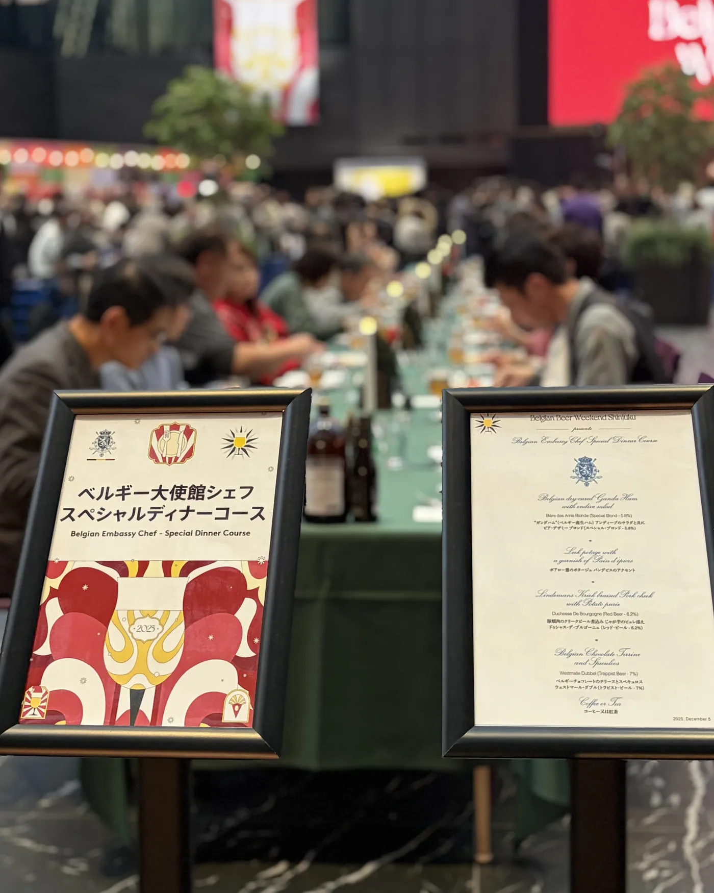 The printed dinner menu at the head of the table, guests seated along it behind